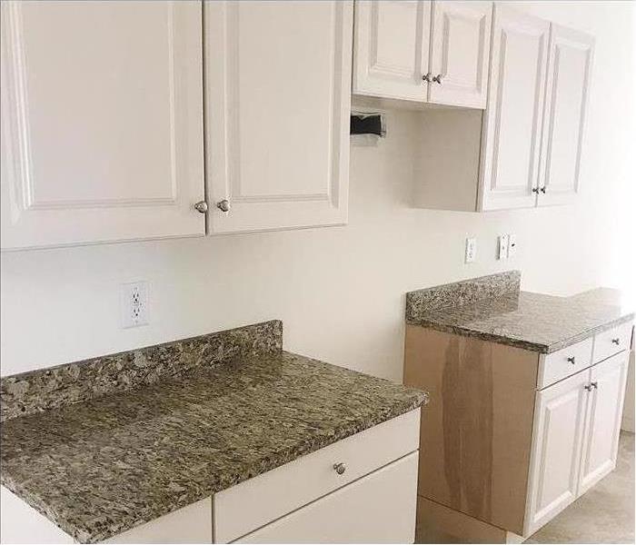 Cleaned kitchen white upper and lower cabinets